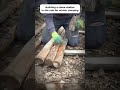 Building a stone shelter in the rain for winter camping #shorts