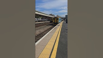 A Network Rail Class 153 (153311) arriving and departing Platform 3 at Exeter St Davids