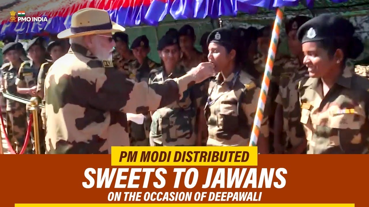 Prime Minister Narendra Modi distributes sweets to Jawans on the ...