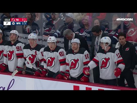 Nico Hischier scores a goal against the Winnipeg Jets