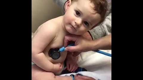 Sweet Baby Boy Rests Head On Nurse's Hand