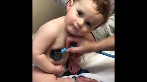 Sweet Baby Boy Rests Head On Nurse's Hand - DayDayNews