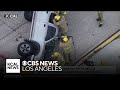 Firefighters rescue driver from overturned truck on 405 Freeway