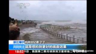 Journalist gets soaked by wave during report