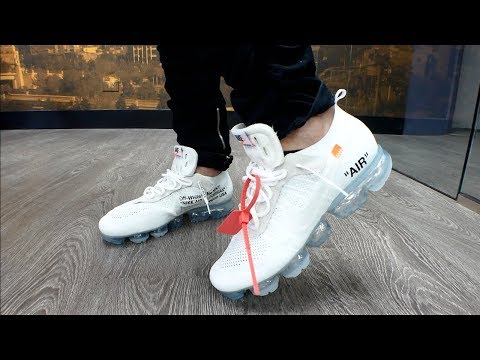 all white vapormax plus on feet