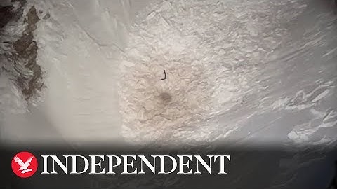 Moment missing hiker buried under avalanche waves down rescue helicopter