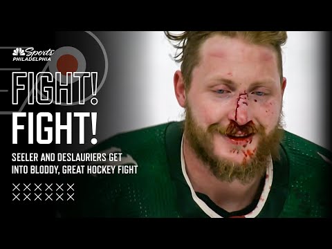 WHAT A FIGHT! Nick Seeler and Nicolas Deslauriers mix it up in a bloody scrap
