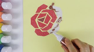 Drawing a rose with sand and glitter