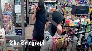 video: Watch: Machete-wielding robbers trapped inside store
