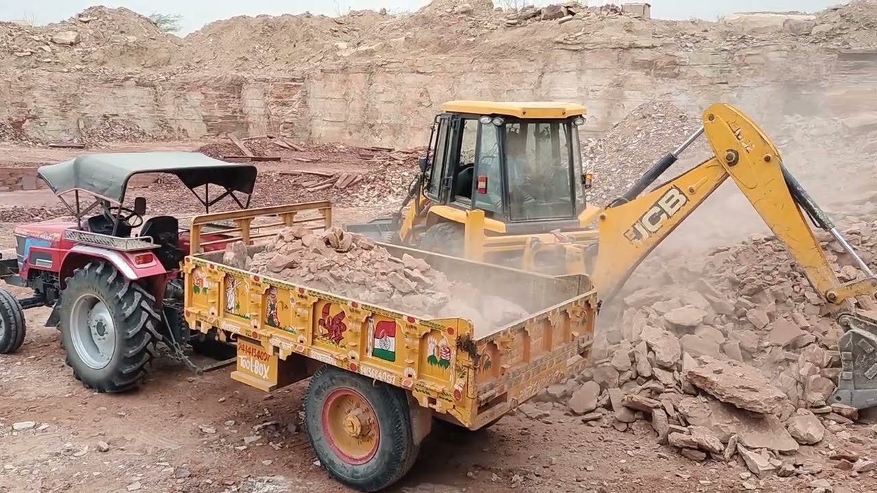 JCB 3DX working for stone mine fully loading stone in tractor ,Arjun,mf241