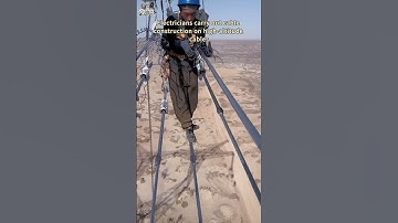 Electricians carry out cable construction on high-altitude cables