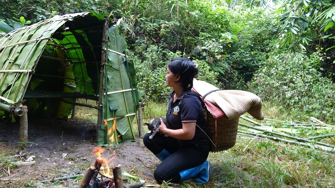 Homeless girl survive alone in the rainforest, live in a makeshift shelter, orphan lives