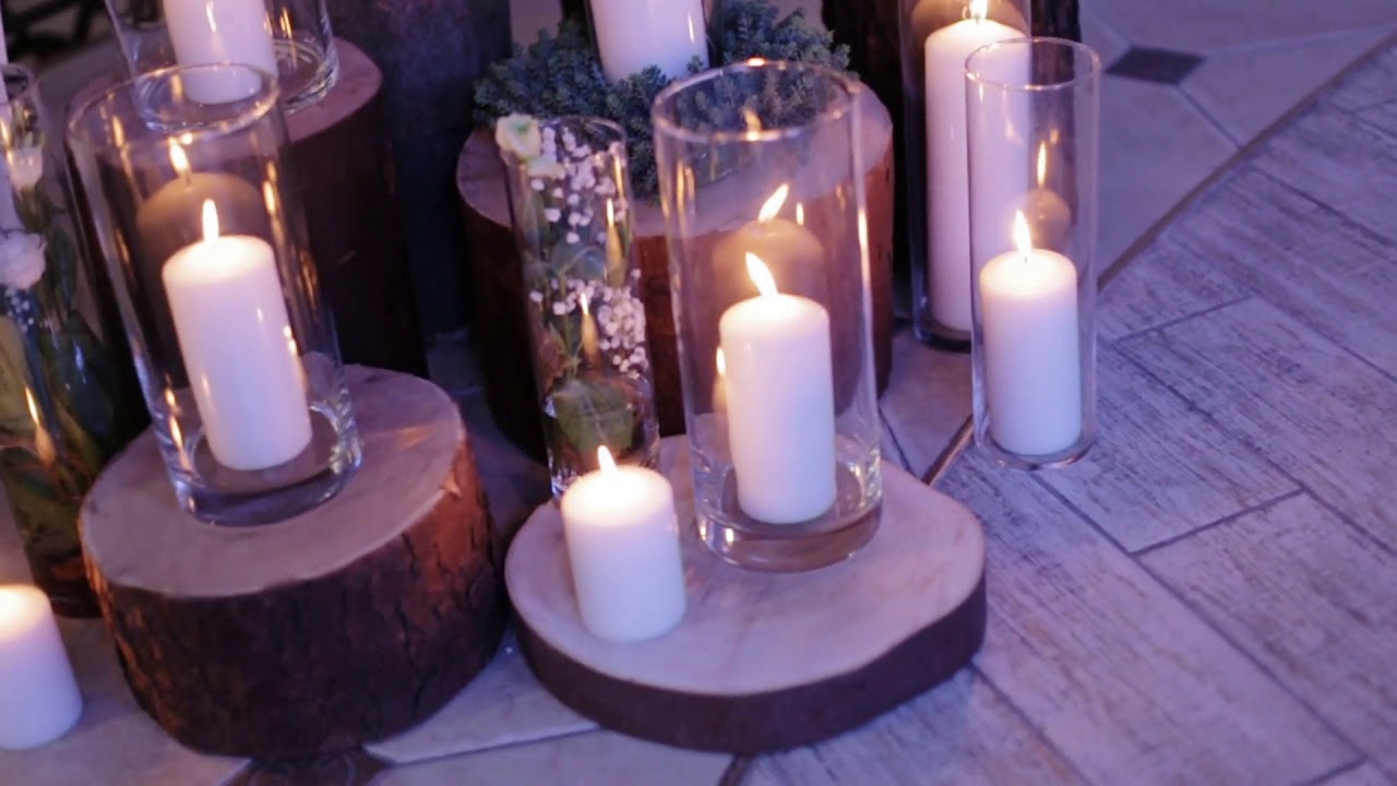 lighted candles on the floor like decor for the wedding day close up shot