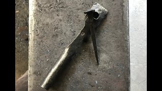 Spike header and a hand forged nail