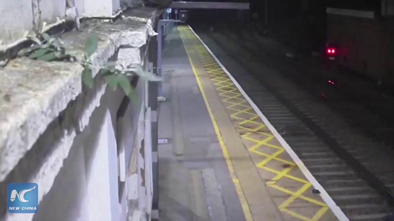 Drunk man narrowly avoids being hit by train - YouTube