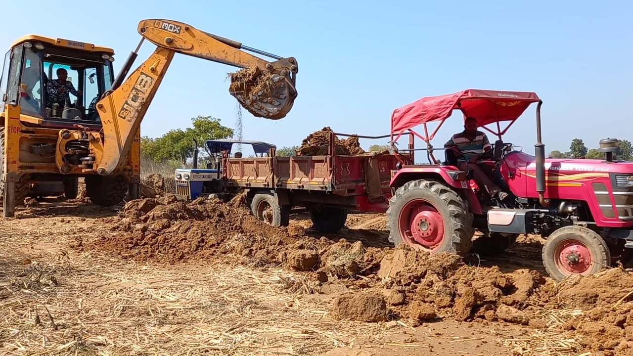 New JCB Backhoe Machine Loading Soil On Mahindra Yuvo And Swaraj