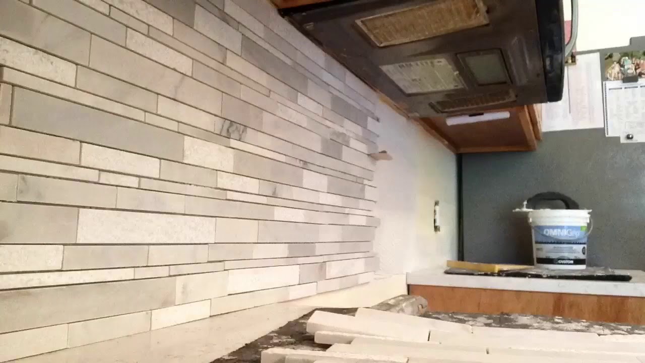 Backsplash tiling across 30" stove gap, under microwave time laps YouTube