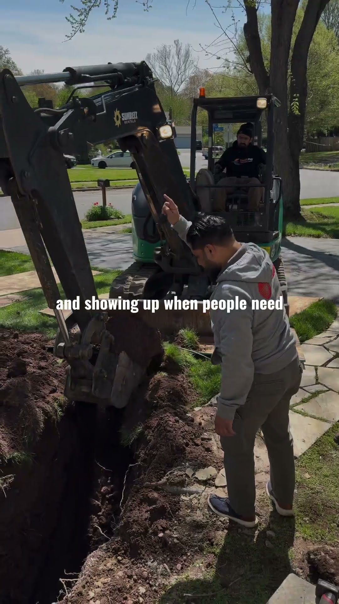 Montage: a tech in a SwiftPro cap and hoodie unloads a boxed Navien NPE-A2 tankless water heater from a van, a mini excavator digs a trench in a front yard while a tech in a grey hoodie checks the lin