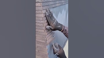 Expertly Placing Thin Stacked Stone or Brick Veneer Tiles onto a Layer of Notched Adhesive