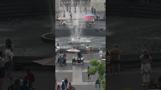 Guy's Playful Water Games in Park's Fountain