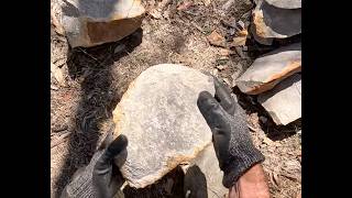 Breaking up a silcrete boulder with hammerstones