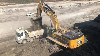 Caterpillar 390D Excavator Loading Mercerdes Arocs Trucks - Pyramis Ate
