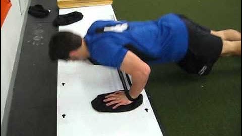 EricCressey.com: Slideboard Pushups with Band