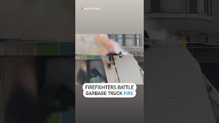 San Fransisco firefighters battle garbage truck flames