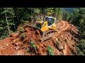 Wonderful Skilled A Massive Bulldozer Building Mountain Cliffside Road for Highway Access Project