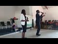 Reagan Mazila live on stage with his wife performing Zion at Muchinga SDA Church.