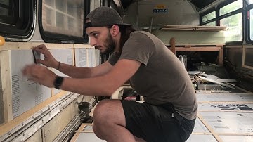 Bus conversion. Putting up the insulation on the walls and floor!