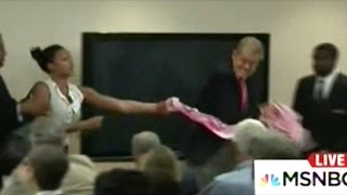 Maddow Makes Fun Of Idiot That Tried To Take Protest Banner Away From Cheney Protester