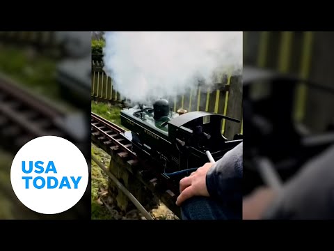 Mini steam train rolls down the tracks in England | USA TODAY