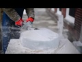 Ice carver Michael Rondeau uses a chainsaw, iron to make a sculpture