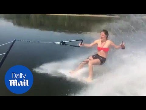 Woman fails to drink beer while barefoot waterskiing - Daily Mail