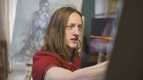 Male Artist Smiles While Painting  Stock Video