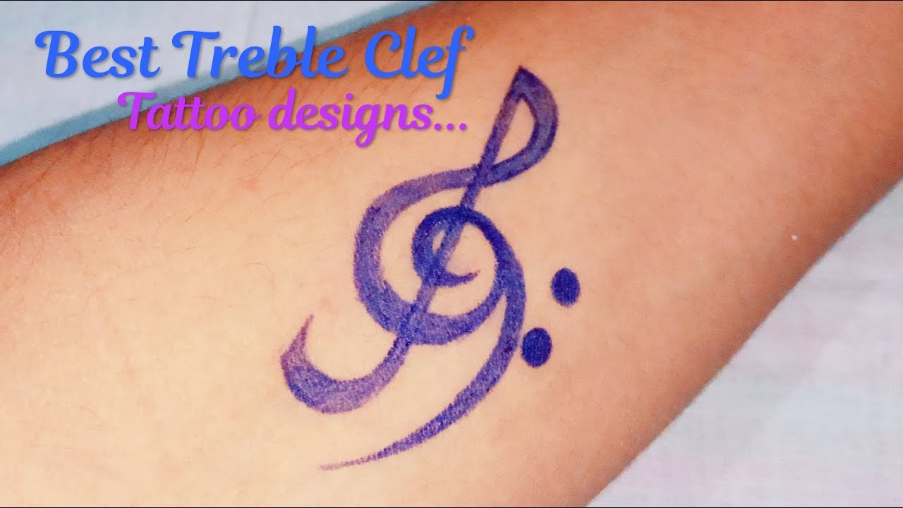 Small minimalist treble clef tattoo on the left wrist