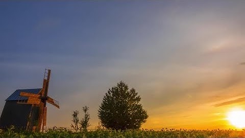 Sunset and an Old Wooden Windmill | Stock Footage - Videohive