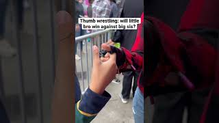 Thumb Wrestling While Waiting In Line.