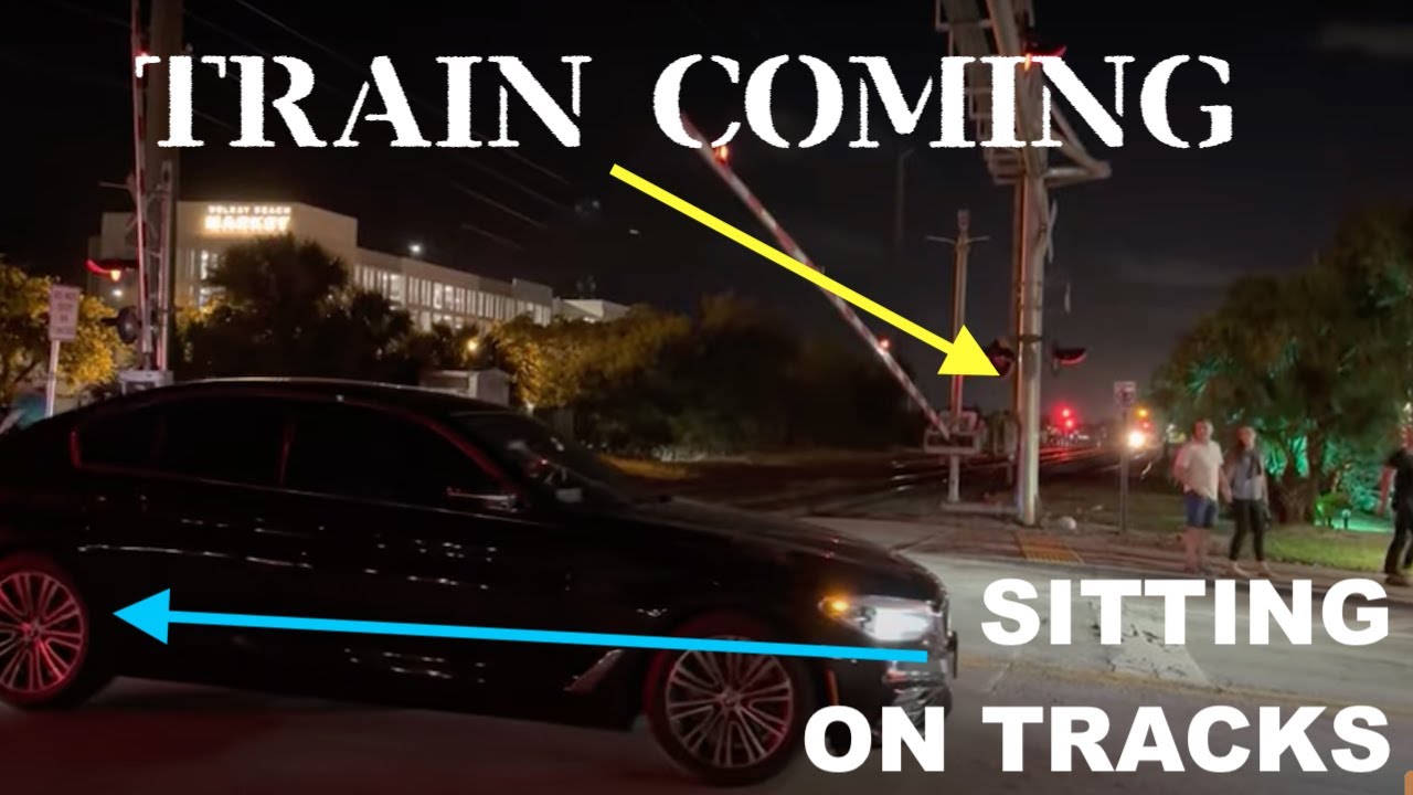 BMW Briefly Stuck In Rail Crossing On Tracks As Train Approaches! - YouTube