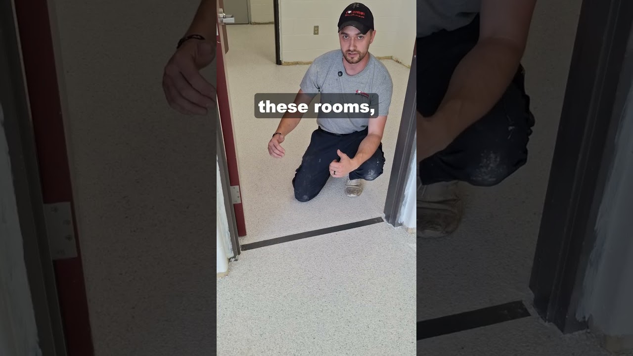 When you’re working with fast-setting products like polyaspartic, timing is everything. If you leave your edges exposed while moving between rooms, the coating starts to tack up. Applying fresh material over that creates a glossy, uneven overlap that ruins the finish.

Our team tapes off every doorway to ensure a perfectly clean stop. When we're ready to tackle the main bay, we know exactly where to line things up for a flawless, level transition.