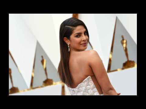 Priyanka Chopra Sparkled in a White Dress Alongside Nick Jonas on the 2019 Billboard Music Awards Red Carpet