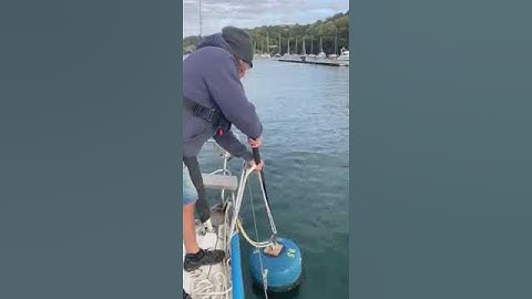 Customer demonstrates using his new Buoycatcher to easily secure his boat to a mooring buoy in Fowey