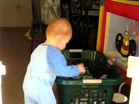 Aaron unpacking the laundry basket - YouTube
