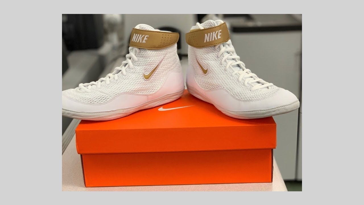 gold and white nike inflicts