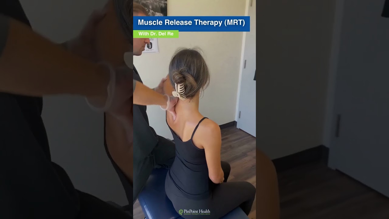 Dr. Del Re completing Muscle Release Therapy to patient’s mid back muscles to help loosen tissues
