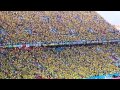 Brazilian supporters sing the national anthem