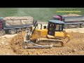 Construction equipment work - dump trucks bulldozer motor grader roller build road