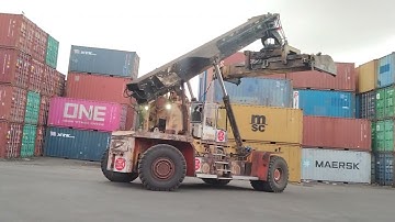 Kalmar Reach stacker with a tilting spreader for container handling