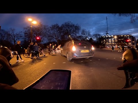 Red light jumping motorist almost takes out a cyclist and pedestrian ...